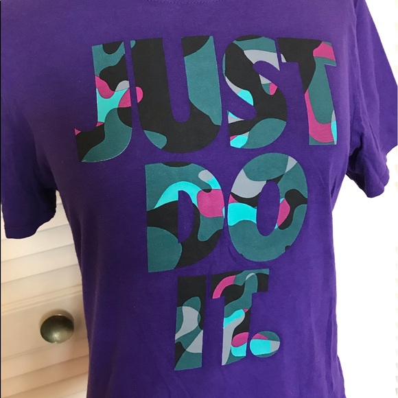 purple and turquoise nike shirt